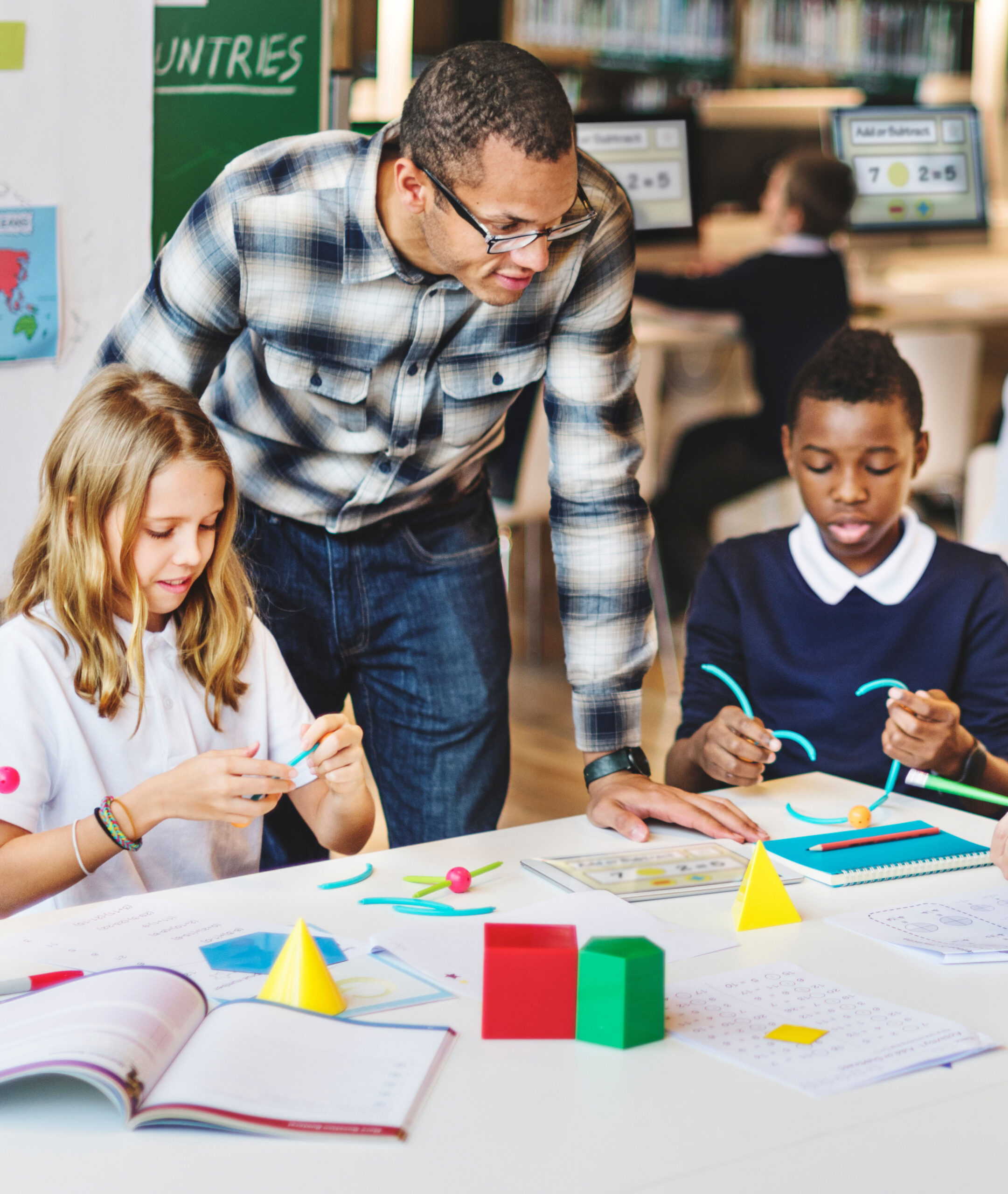 Teacher working with students